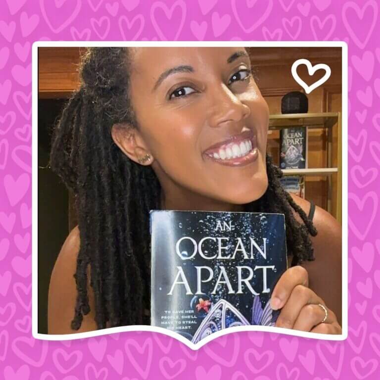 Author Jill Tew poses with her book An Ocean Apart