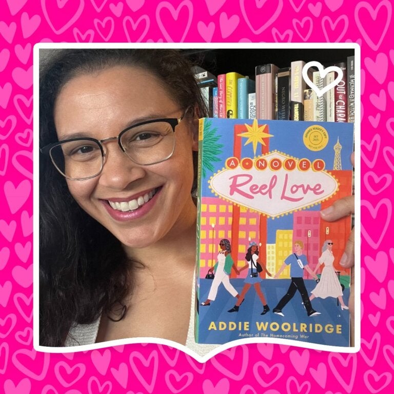Author Addie Woolridge poses with her YA romance book Reel Love