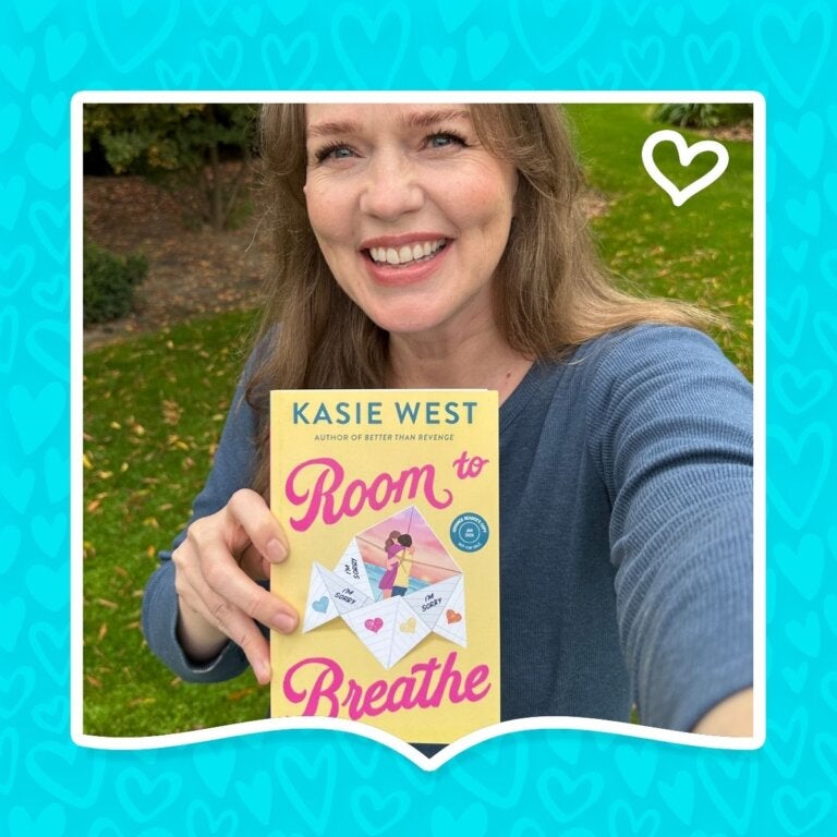 Author Kasie West poses with her YA romance book, Room to Breathe